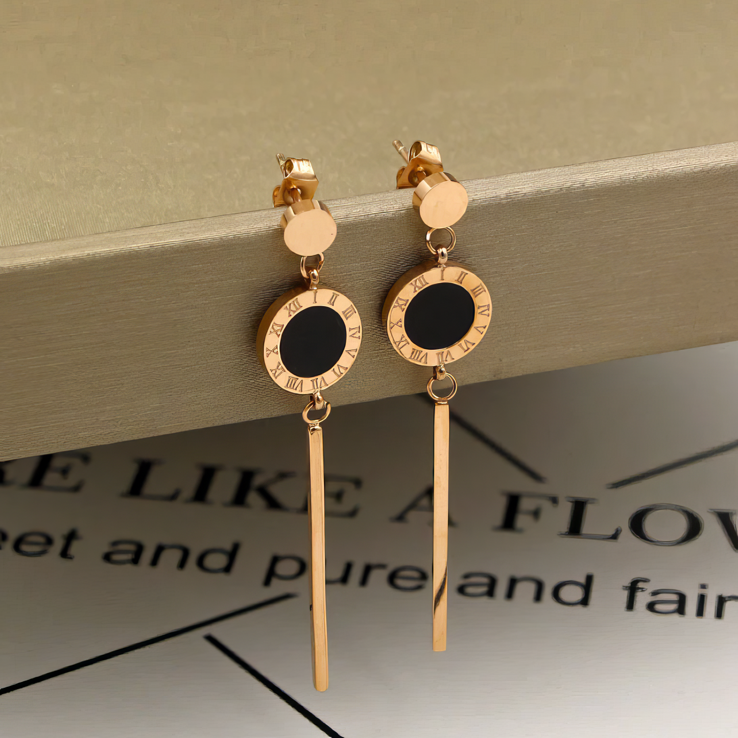 Roman Numerals Dangle Earrings in Rose Gold in Black